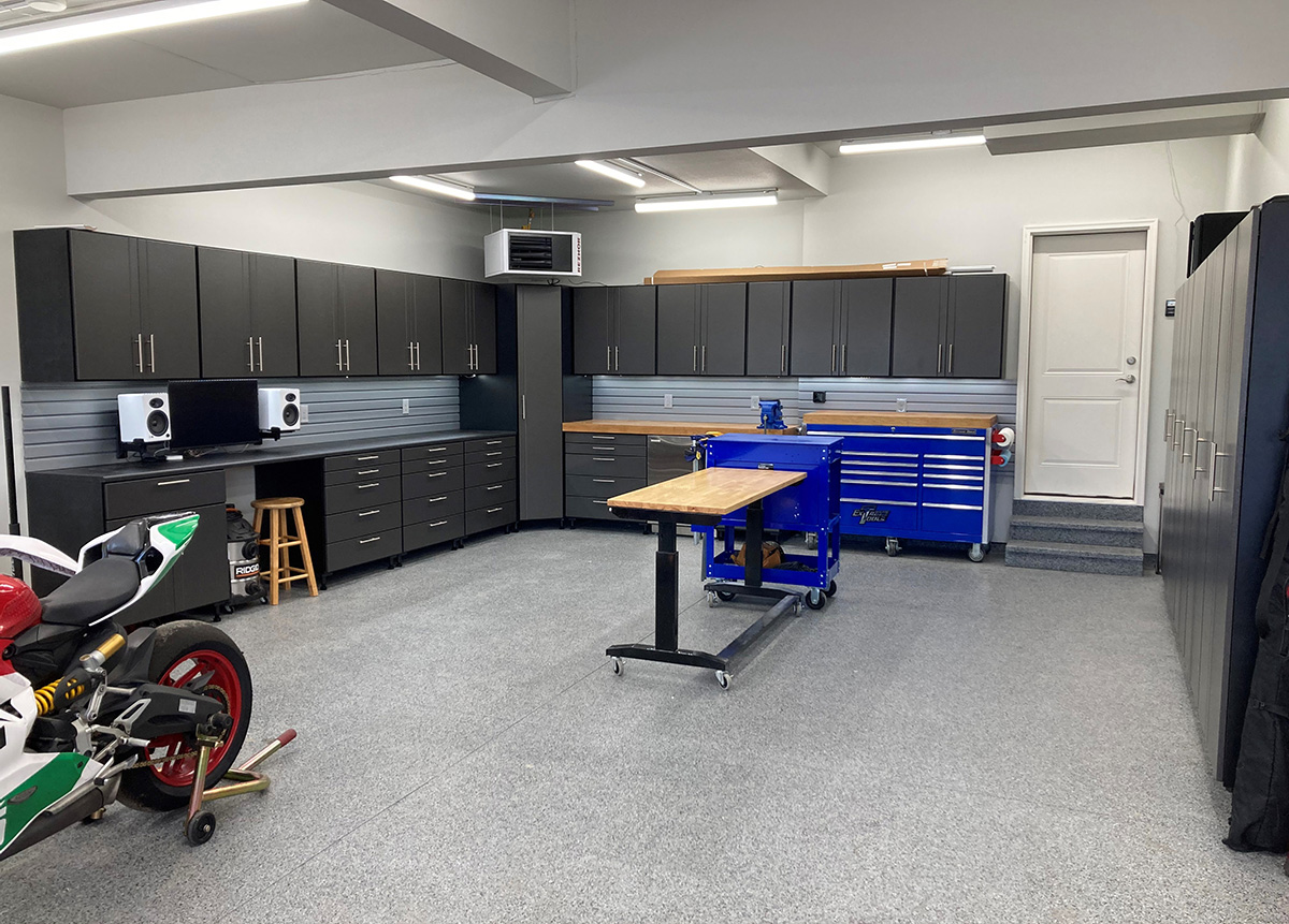 Custom black and pewter garage cabinets with organized storage
